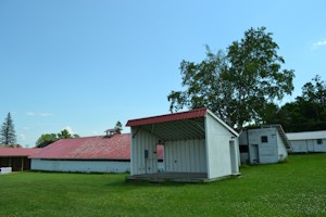 Entertainment stage with dairy barn in background
